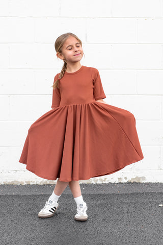 MID SLEEVE TWIRL DRESS- Rust Micro Rib